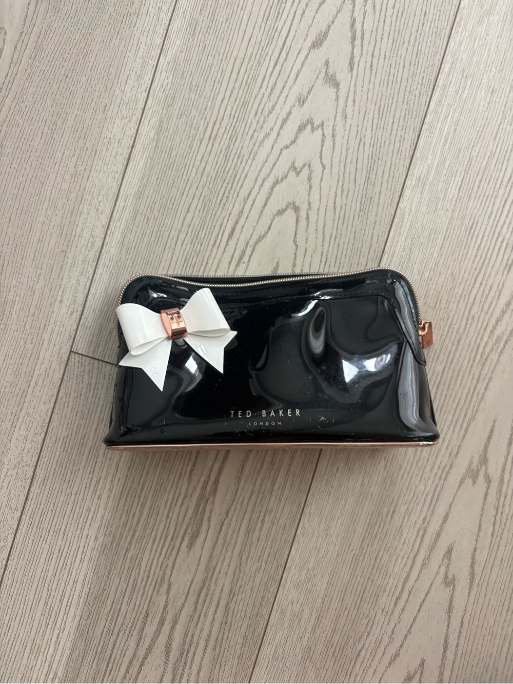 Ted Baker Black Patent Cosmetic Pouch with White Bow and Rose Gold Trim